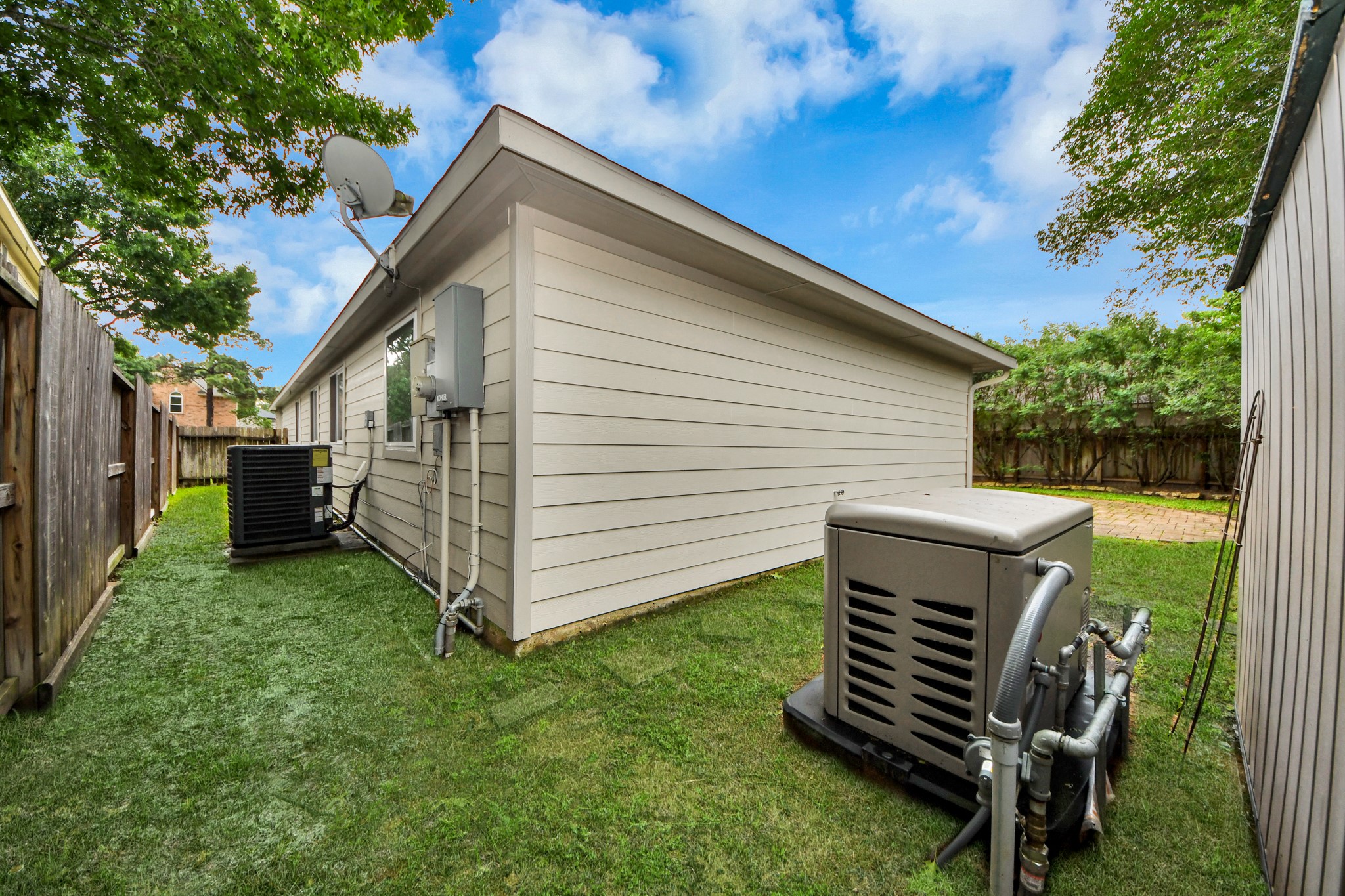 5622 Pineaster Pointe Lane Spring, TX 77379 - Photo 38 of 40 Side yard with a manicured lawn, horizontal vinyl siding, and a wooden privacy fence