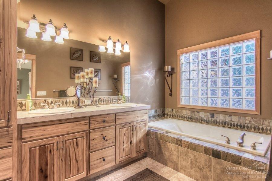 56724 Spring River Loop Bend, OR 97707 - Photo 16 of 24 Master bathroom features double vanity,