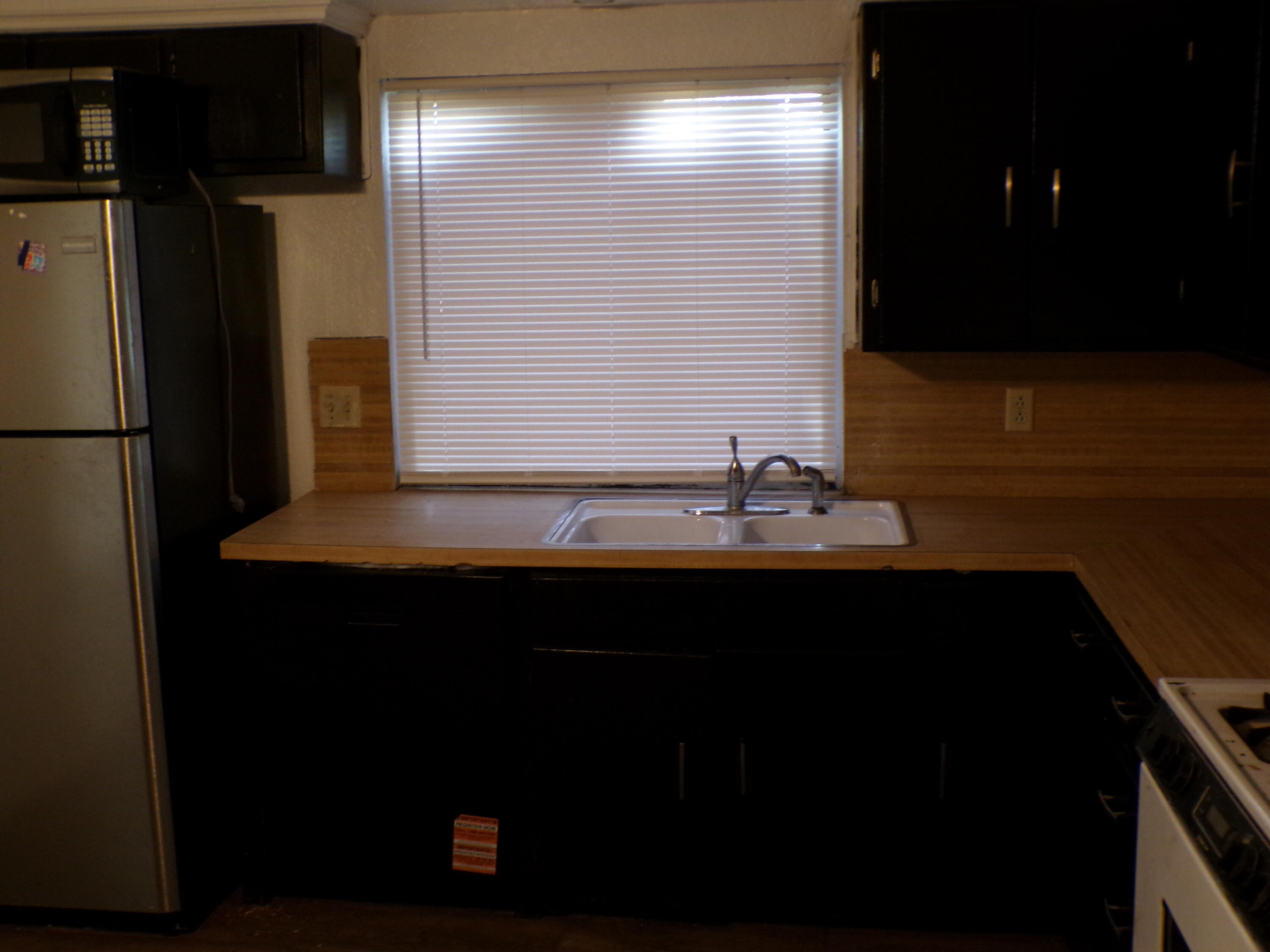 5916 14th Street Lubbock, TX 79416 - Photo 18 of 22 a bathroom with a sink and a mirror