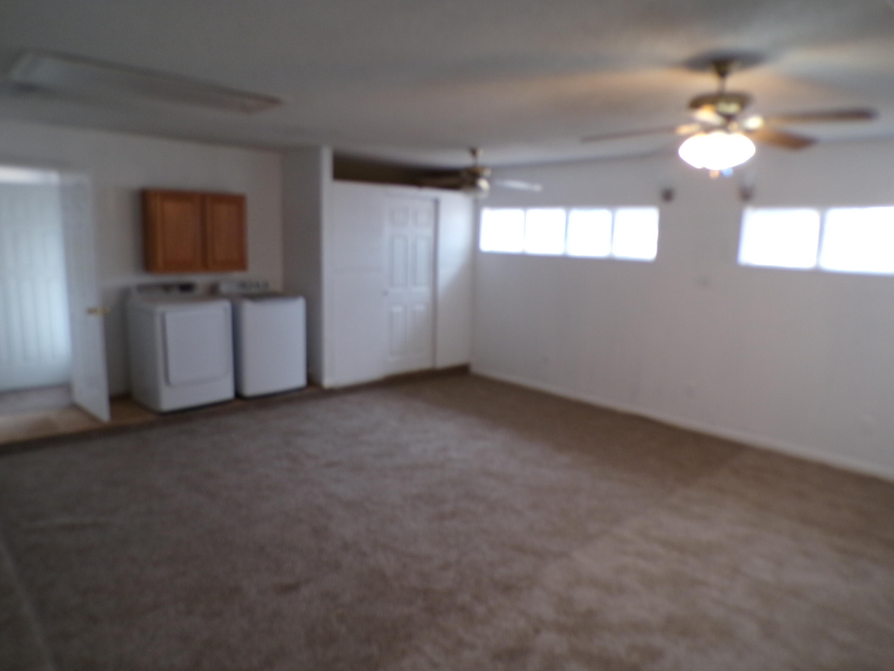 5916 14th Street Lubbock, TX 79416 - Photo 19 of 22 a view of a livingroom with an empty space and a window