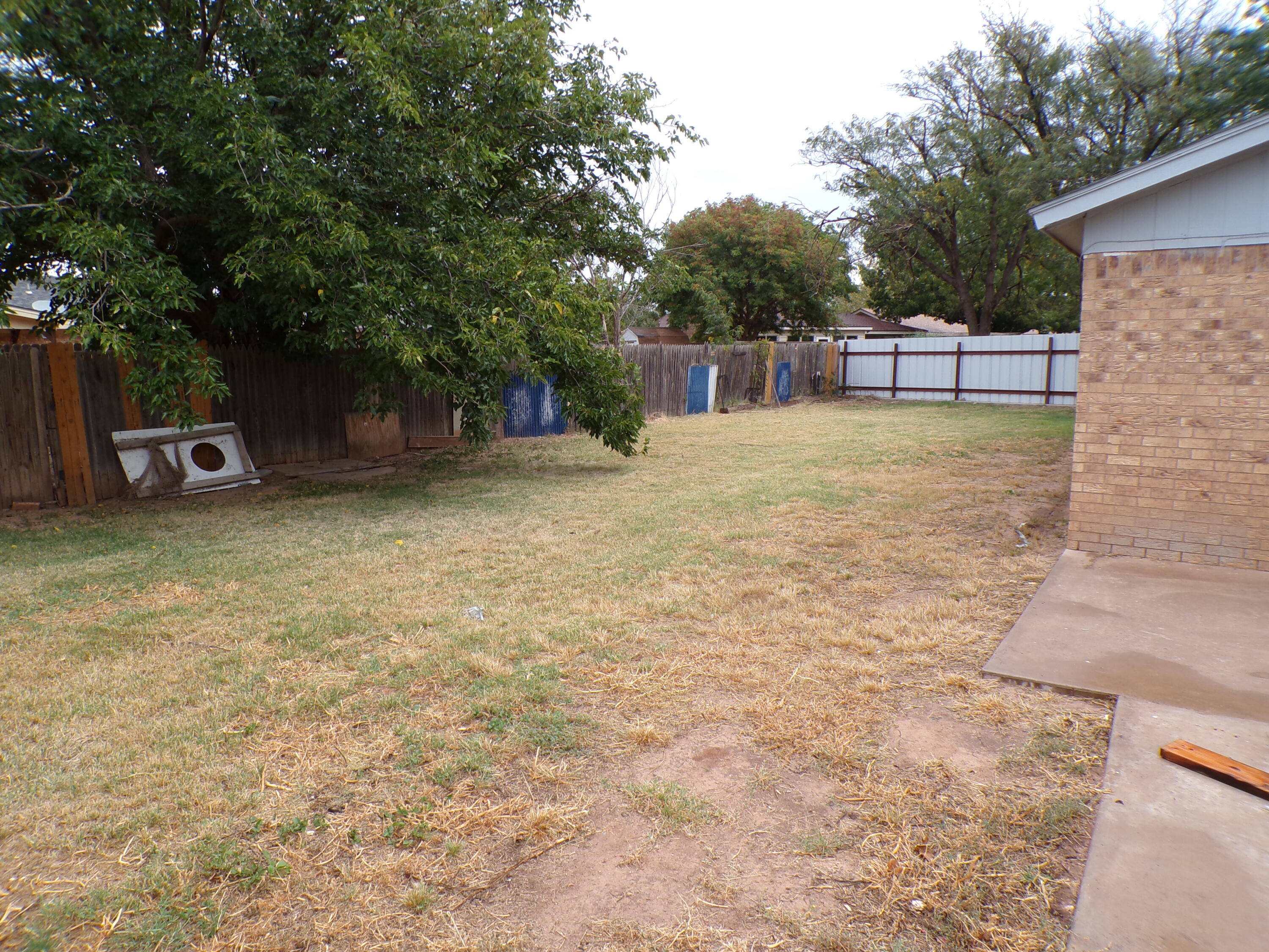 5916 14th Street Lubbock, TX 79416 - Photo 22 of 22 a view of a yard with a table and chair