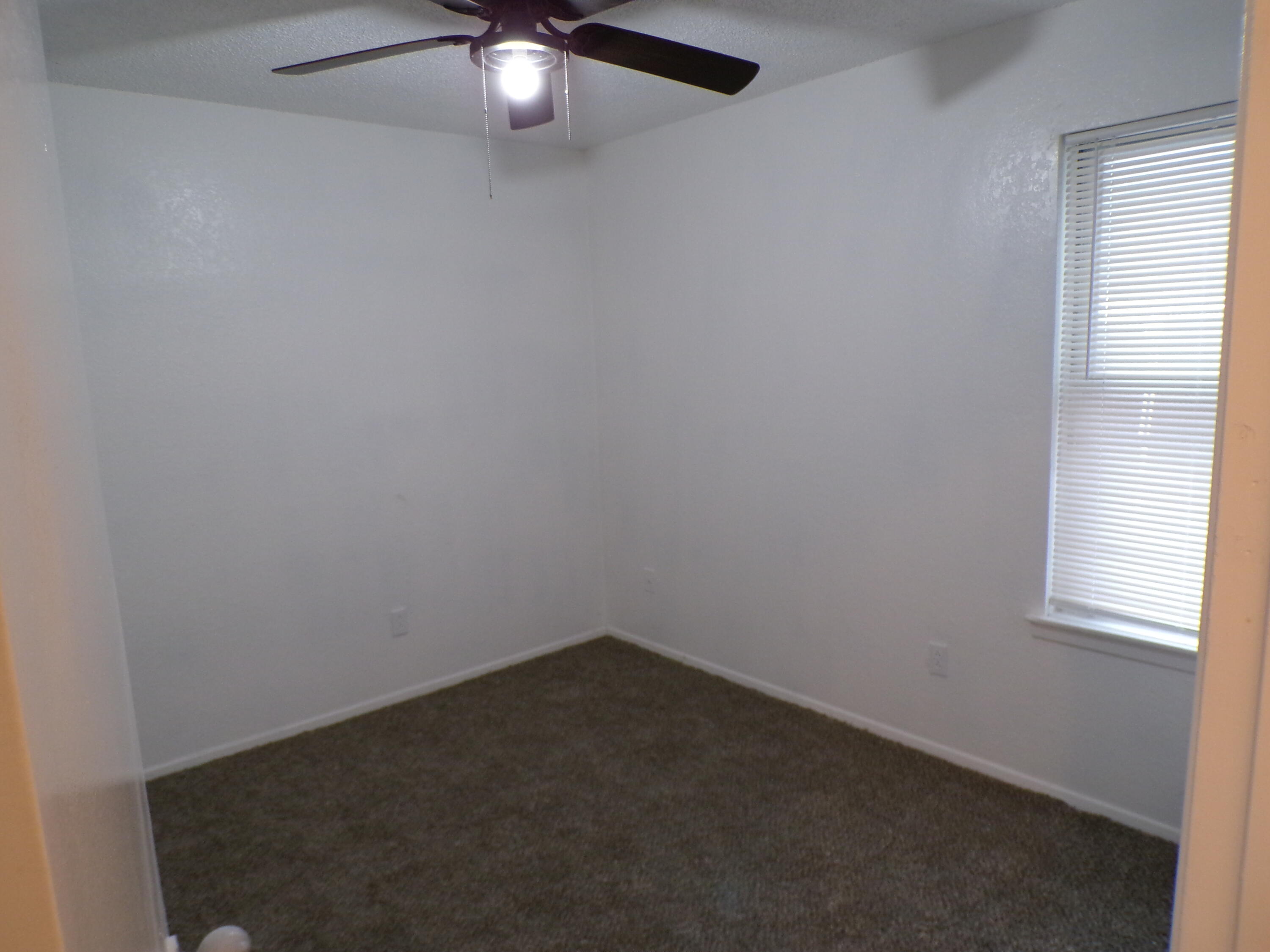 5916 14th Street Lubbock, TX 79416 - Photo 8 of 22 an empty room with a window