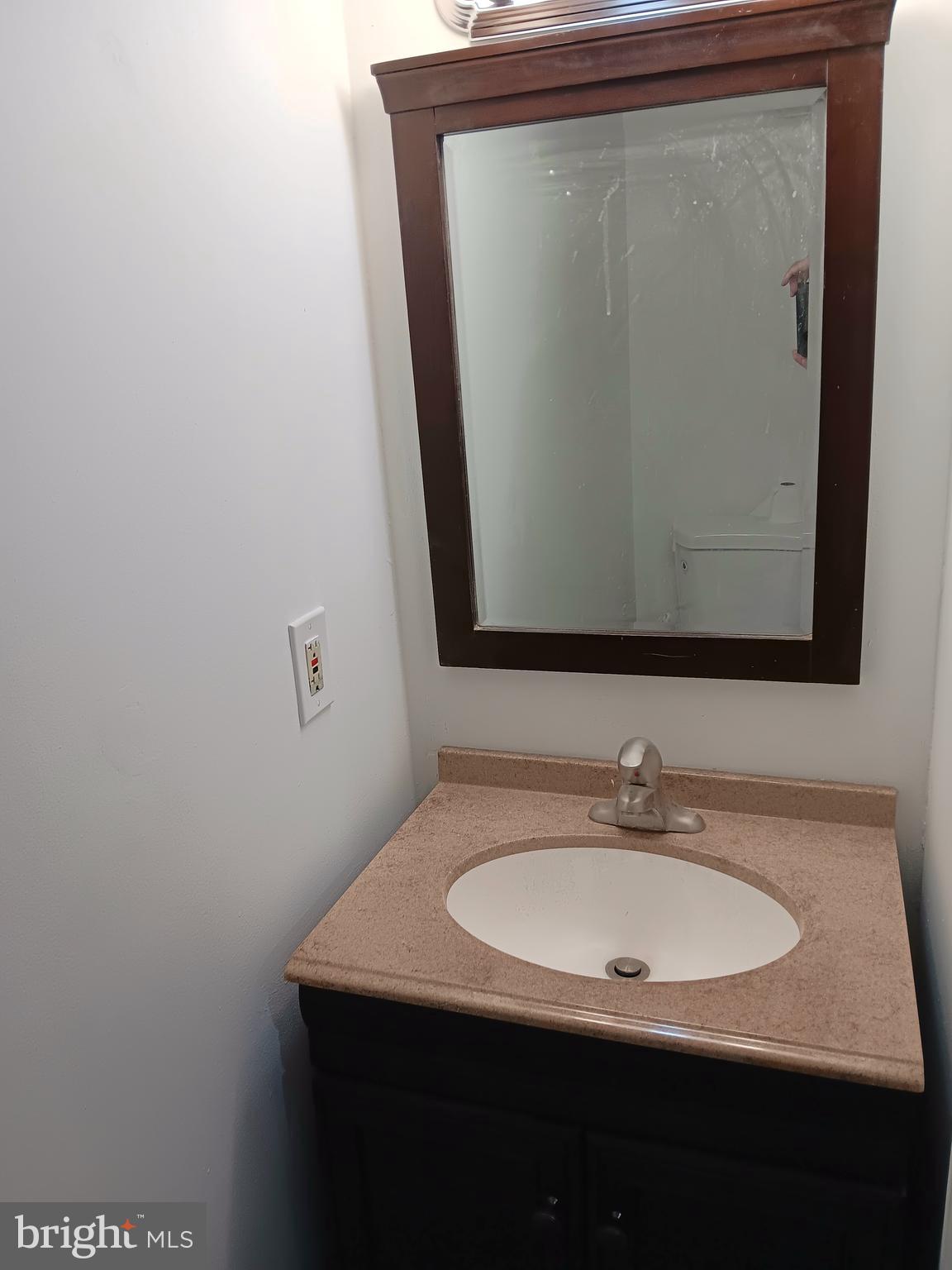 26 East Lynbrook Road Collingdale, PA 19023 - Photo 18 of 21 a bathroom with a sink and a mirror
