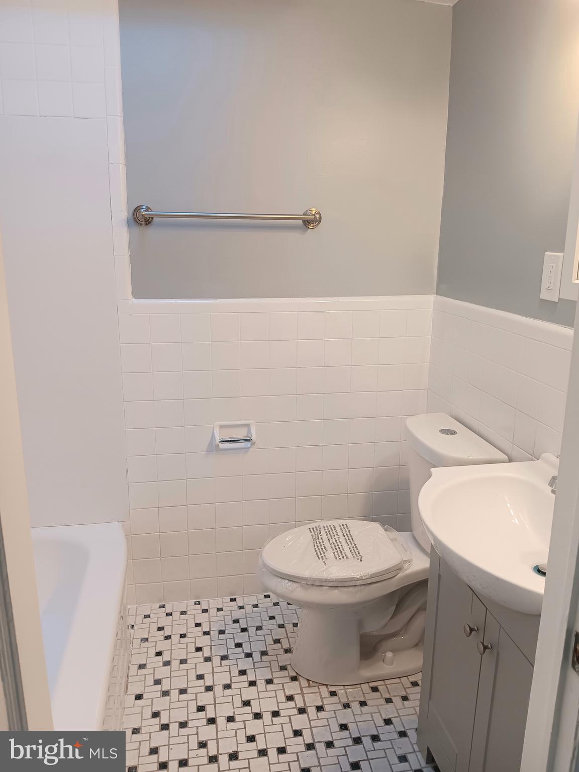 26 East Lynbrook Road Collingdale, PA 19023 - Photo 10 of 21 a white toilet sitting next to a shower in a bathroom