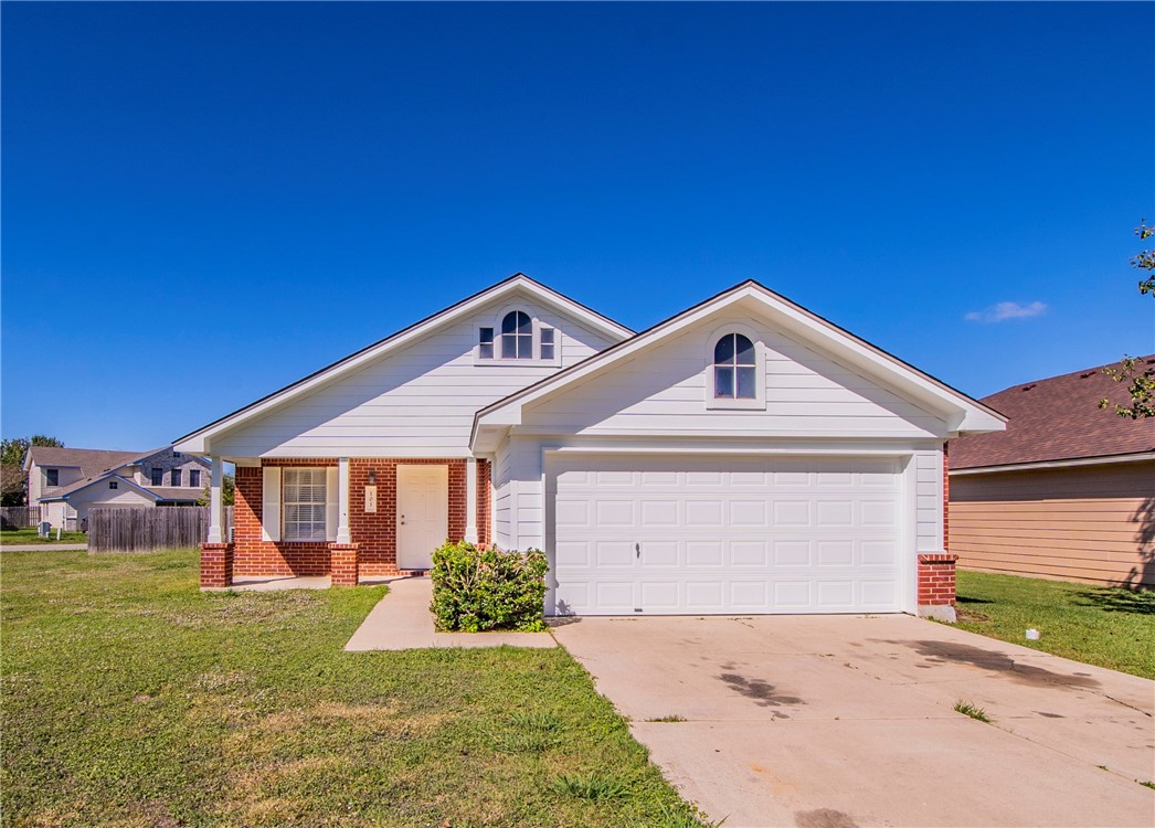 101 Madisons Way Buda, TX 78610 - Photo 1 of 1 a front view of a house with a yard