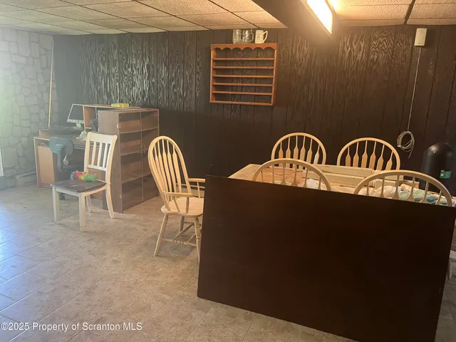 a view of balcony with two chairs and a table