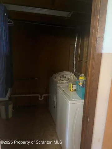 a view of a hallway with washer and dryer