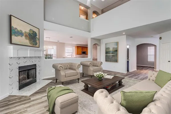 a living room with furniture and a fireplace