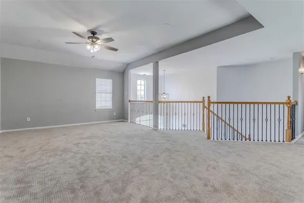 a view of a hallway with windows