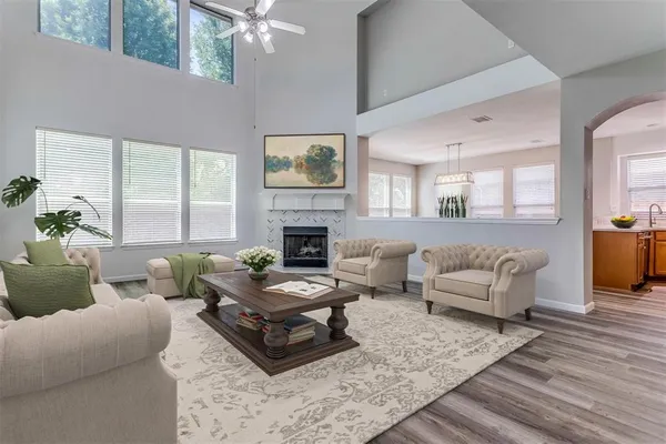 a living room with furniture and a fireplace