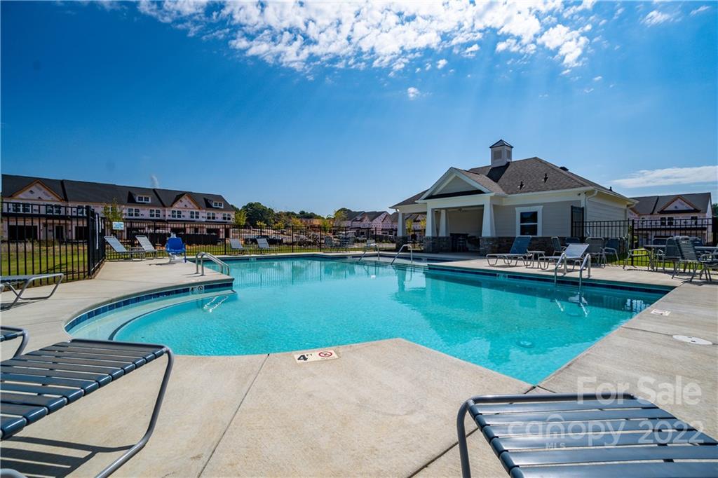 3734 Yorkshire Place Terrell, NC 28682 - Photo 8 of 13 a front view of a house with swimming pool yard and outdoor seating