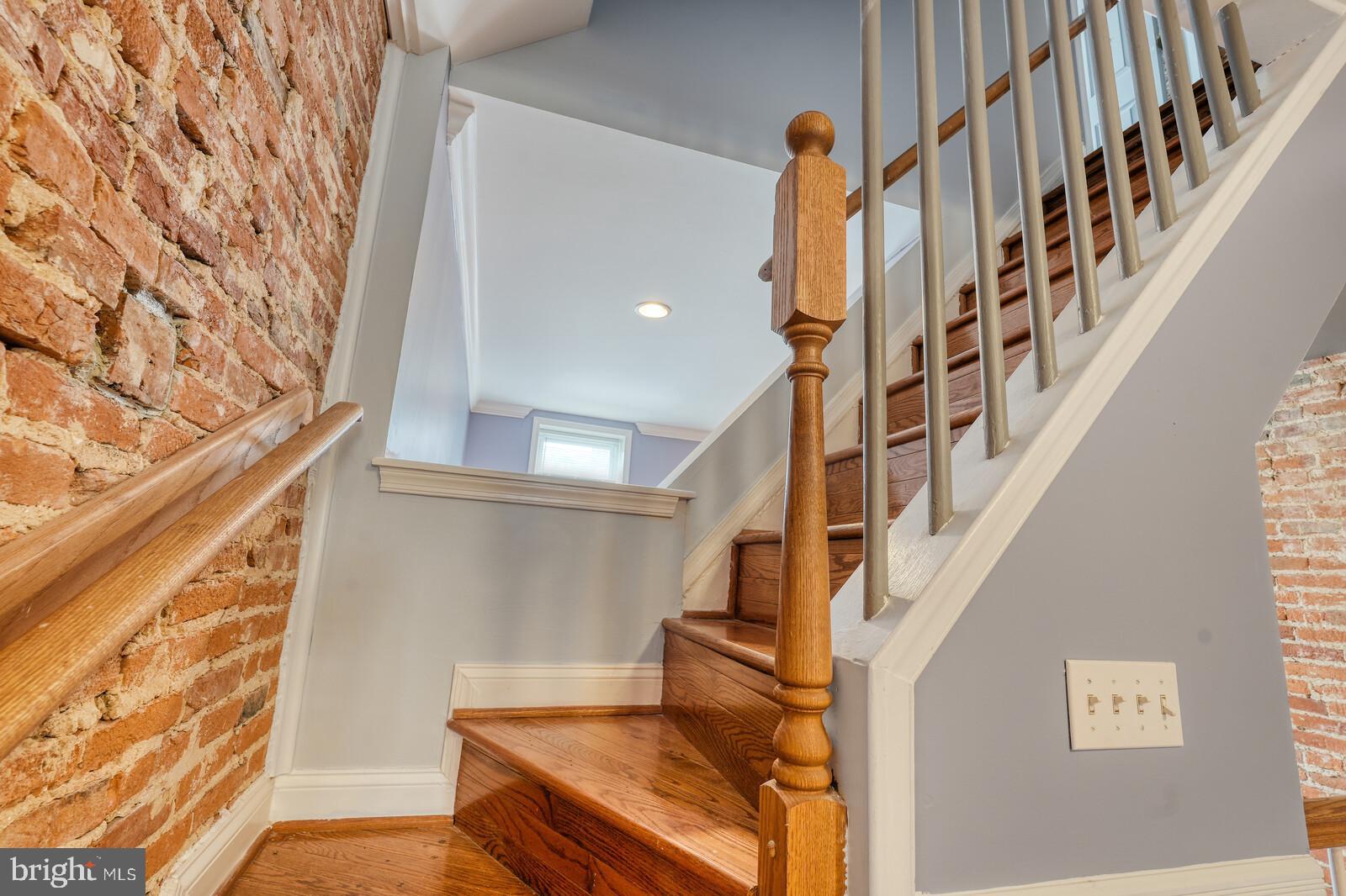 1212 Marshall Street Baltimore, MD 21230 - Photo 16 of 39 a view of entryway with a front door and wooden floor