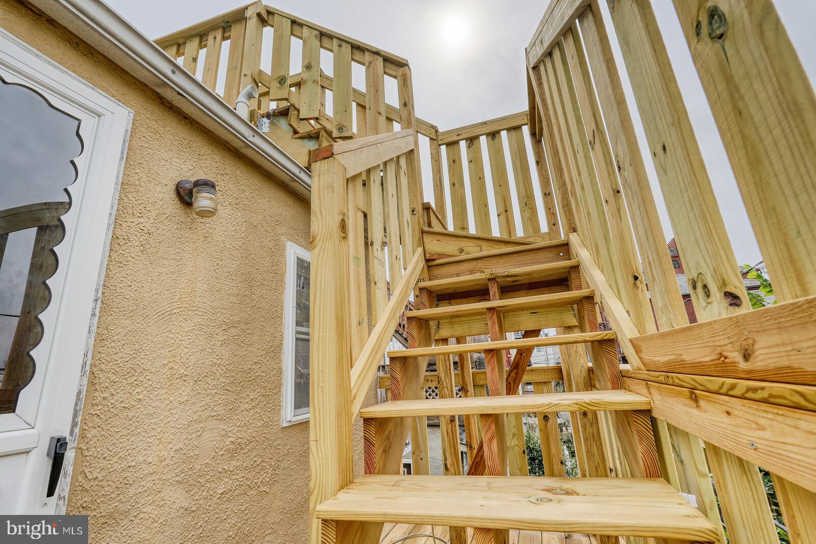 1212 Marshall Street Baltimore, MD 21230 - Photo 28 of 39 a view of a building with stairs and wooden floor