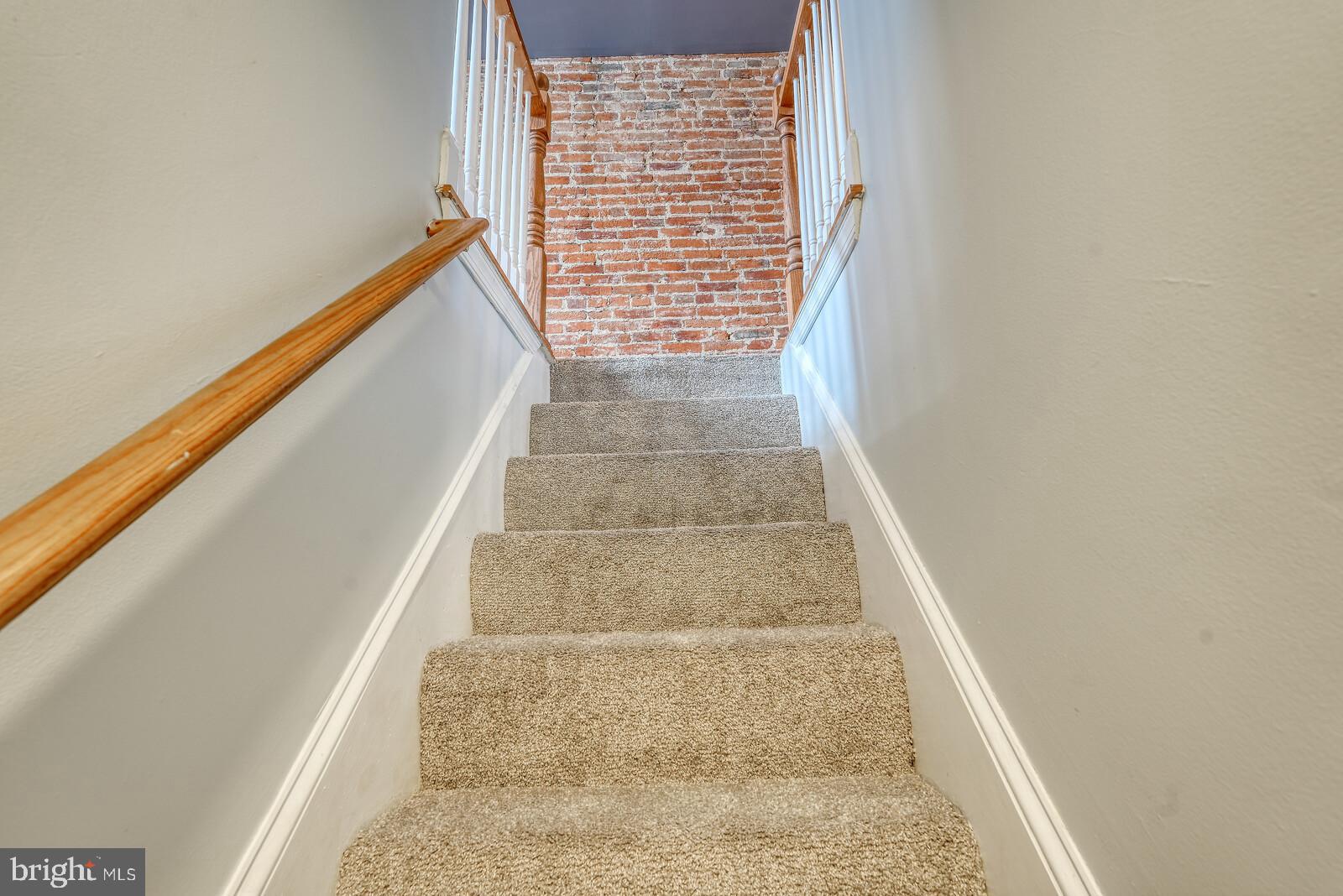 1212 Marshall Street Baltimore, MD 21230 - Photo 36 of 39 a view of staircase with white walls and window
