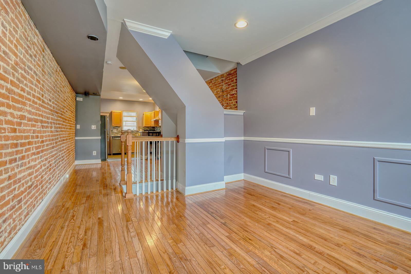 1212 Marshall Street Baltimore, MD 21230 - Photo 5 of 39 a view of entryway with wooden floor