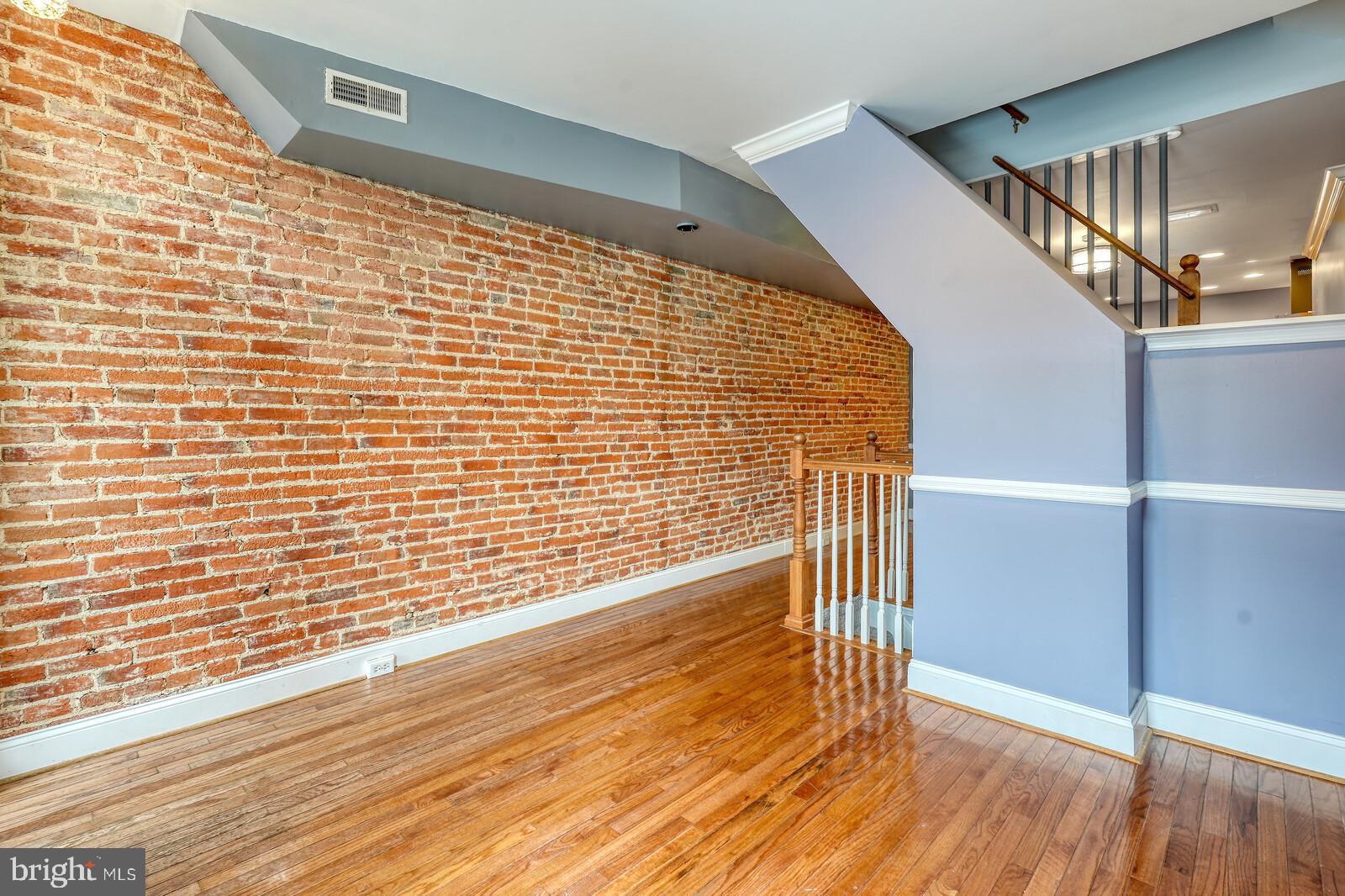 1212 Marshall Street Baltimore, MD 21230 - Photo 6 of 39 a view of wooden floor with staircase