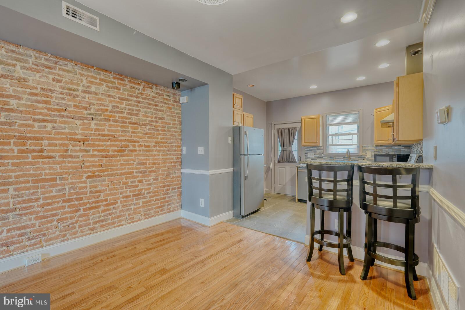 1212 Marshall Street Baltimore, MD 21230 - Photo 9 of 39 a view of a dining room with furniture and wooden floor