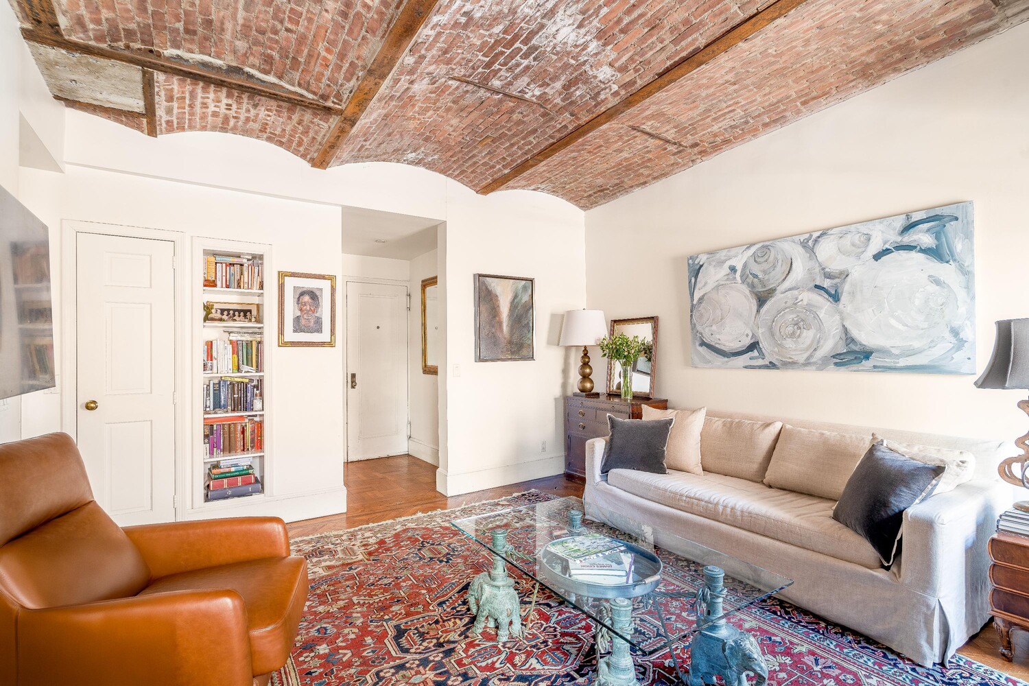 205 West 57th Street, Unit 11CD Manhattan, NY 10019 - Photo 4 of 15 a living room with furniture and wooden floor