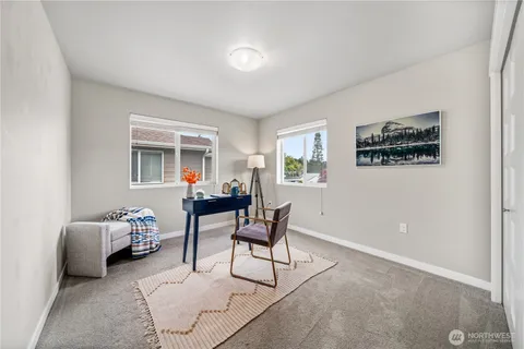 a bedroom with furniture and a window