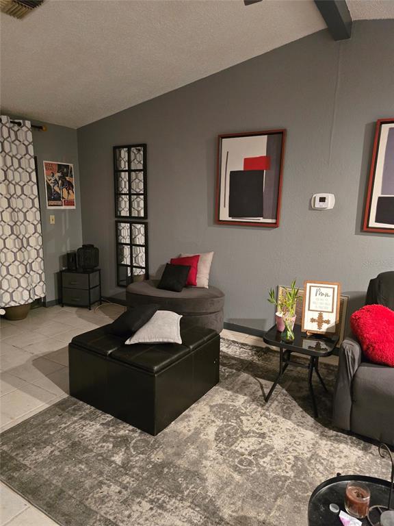 140 Callaway Avenue Spring Hill, FL 34606 - Photo 14 of 16 a living room with furniture and a flat screen tv