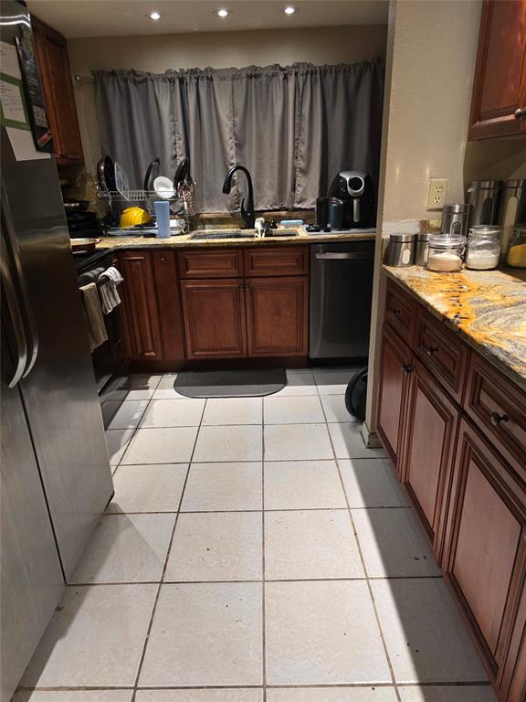 140 Callaway Avenue Spring Hill, FL 34606 - Photo 5 of 16 a kitchen with a sink a stove and cabinets