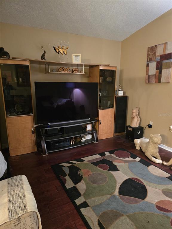 140 Callaway Avenue Spring Hill, FL 34606 - Photo 6 of 16 a living room with furniture and a flat screen tv