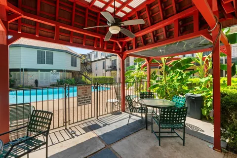 a view of a chairs and table in the patio