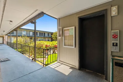a view of a porch with a small yard