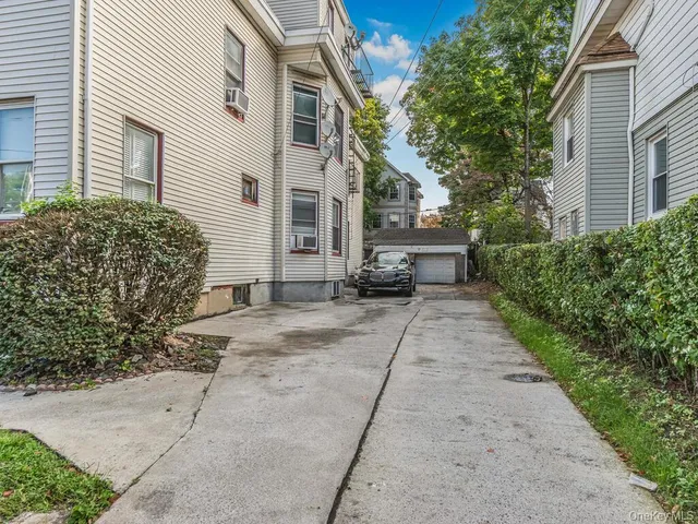 a view of a yard with potted plants