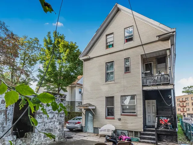 a view of a house with a street