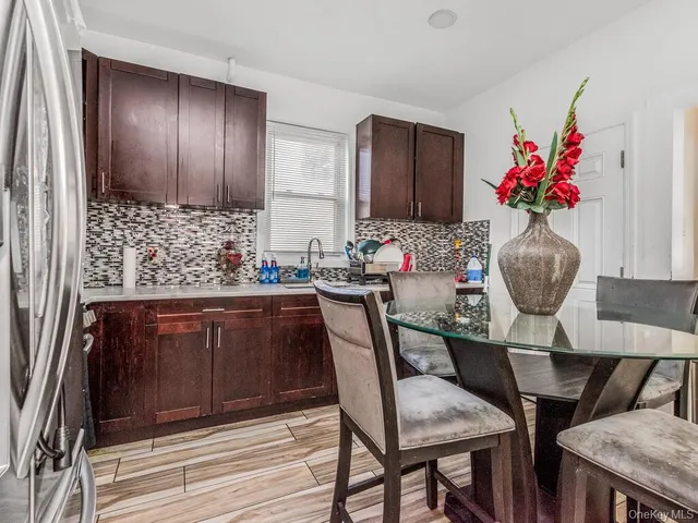 a dining room with furniture and wooden floor