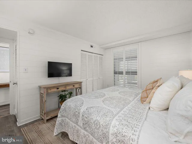a bathroom with a sink mirror vanity and toilet
