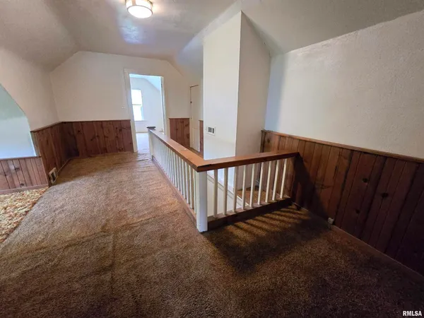 a view of staircase with wooden floor