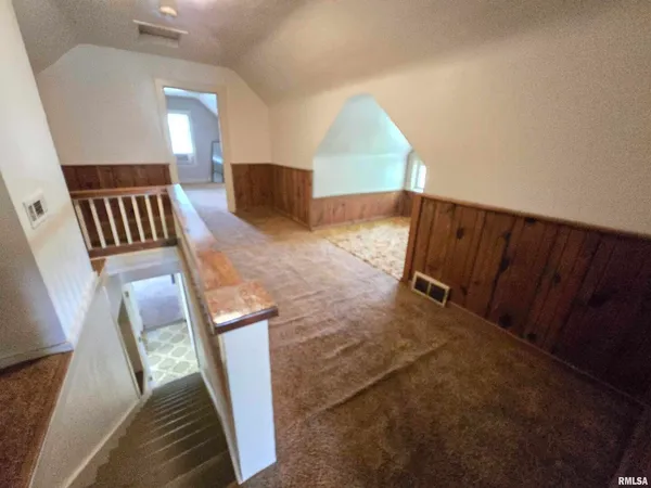 a view of room with window and wooden floor