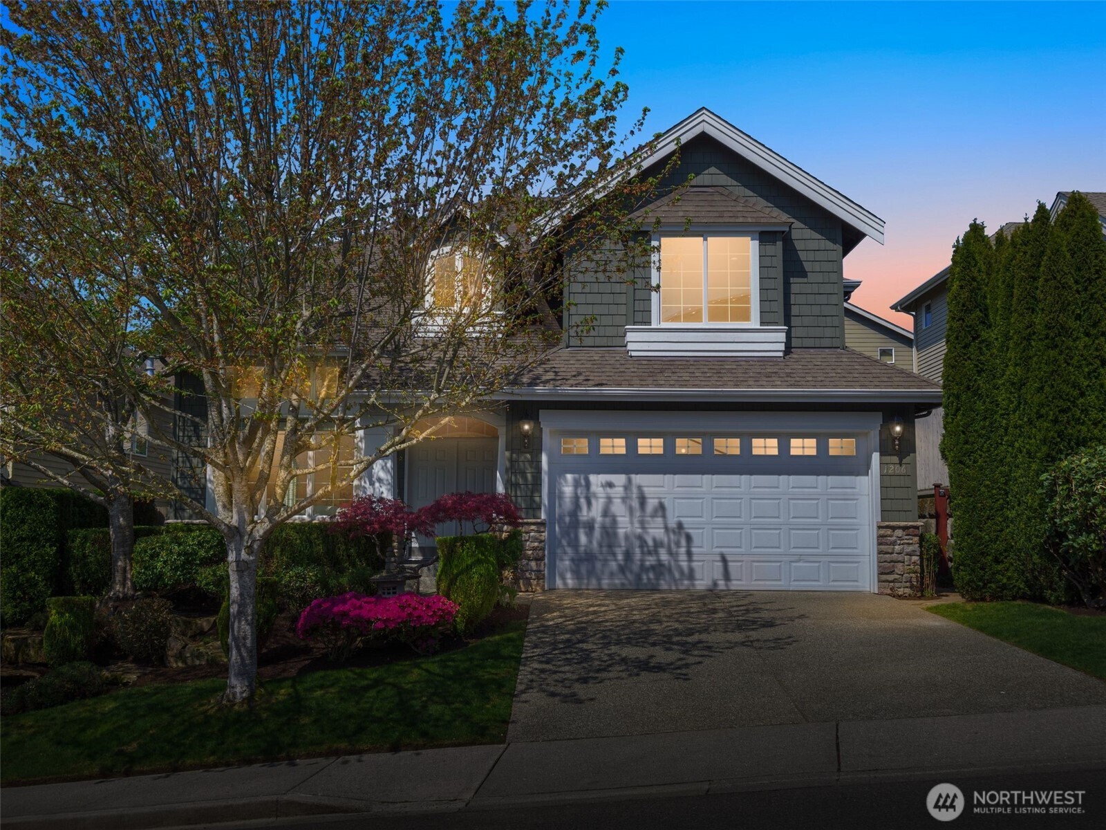 1206 South 36th Place Renton, WA 98055 - Photo 37 of 37 a front view of a house with a garden