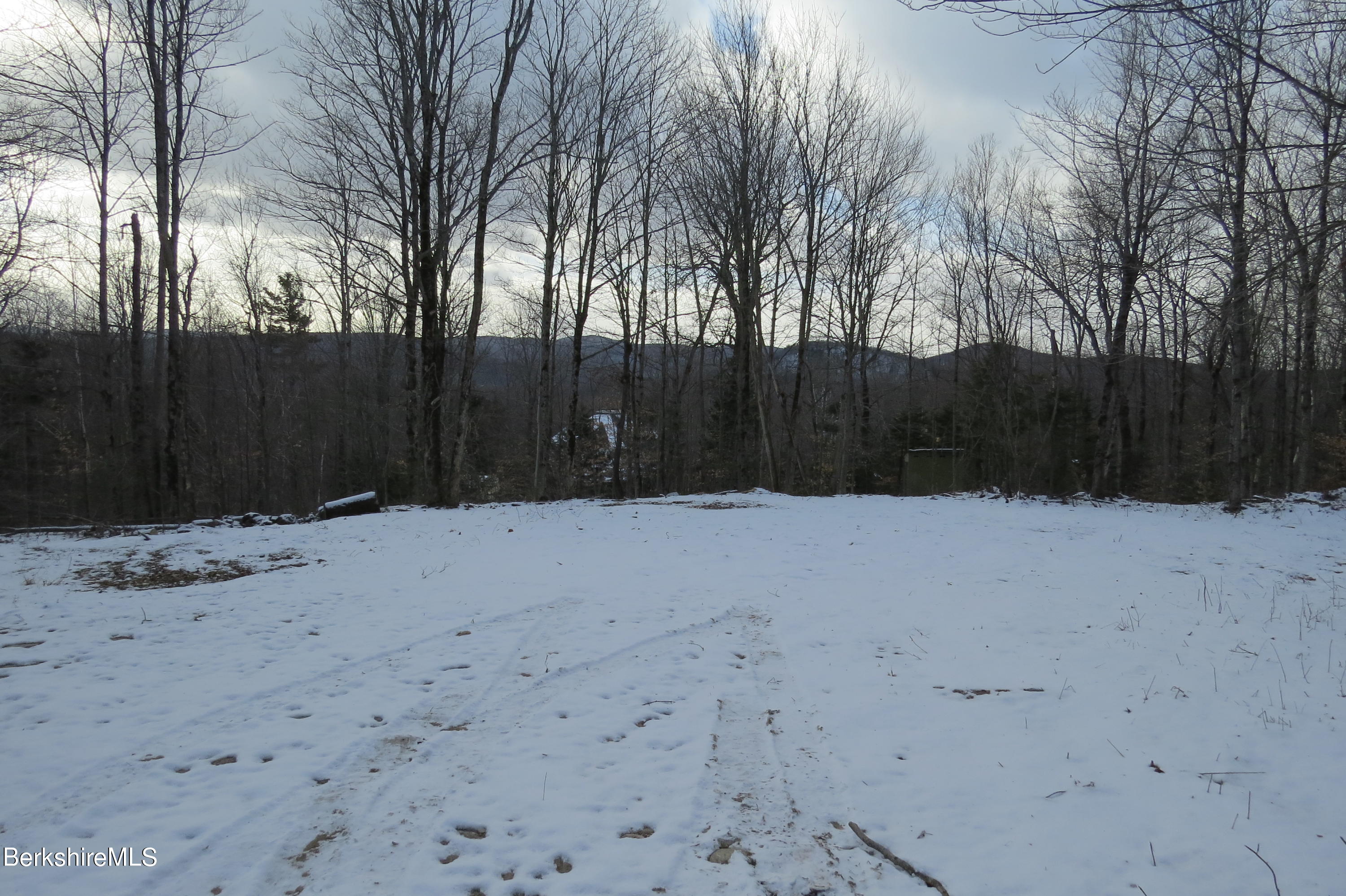0 Bailey Hill Road Readsboro, VT 05350 - Photo 7 of 16 a street view with wooden fence and trees