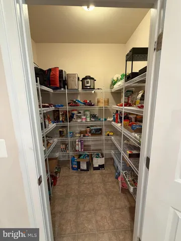 a kitchen with sink and refrigerator