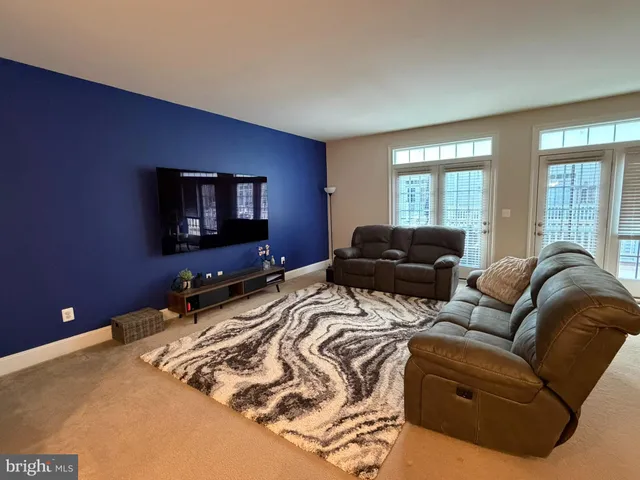 a living room with furniture and window
