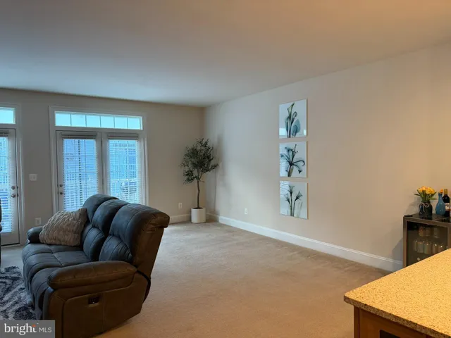 a view of a hallway with seating area
