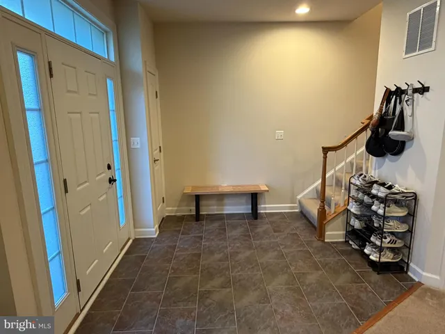 a room with furniture and a flat screen tv