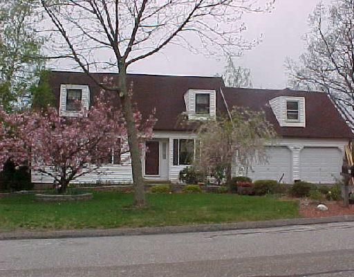 65 Lazy Brook Road Monroe, CT 06468 - Photo 1 of 1 a front view of a house with a yard and a garage