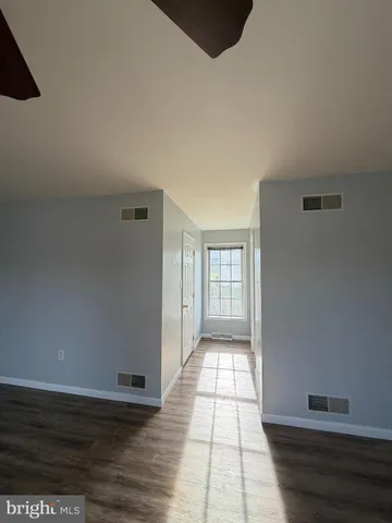 a view of an empty room and window