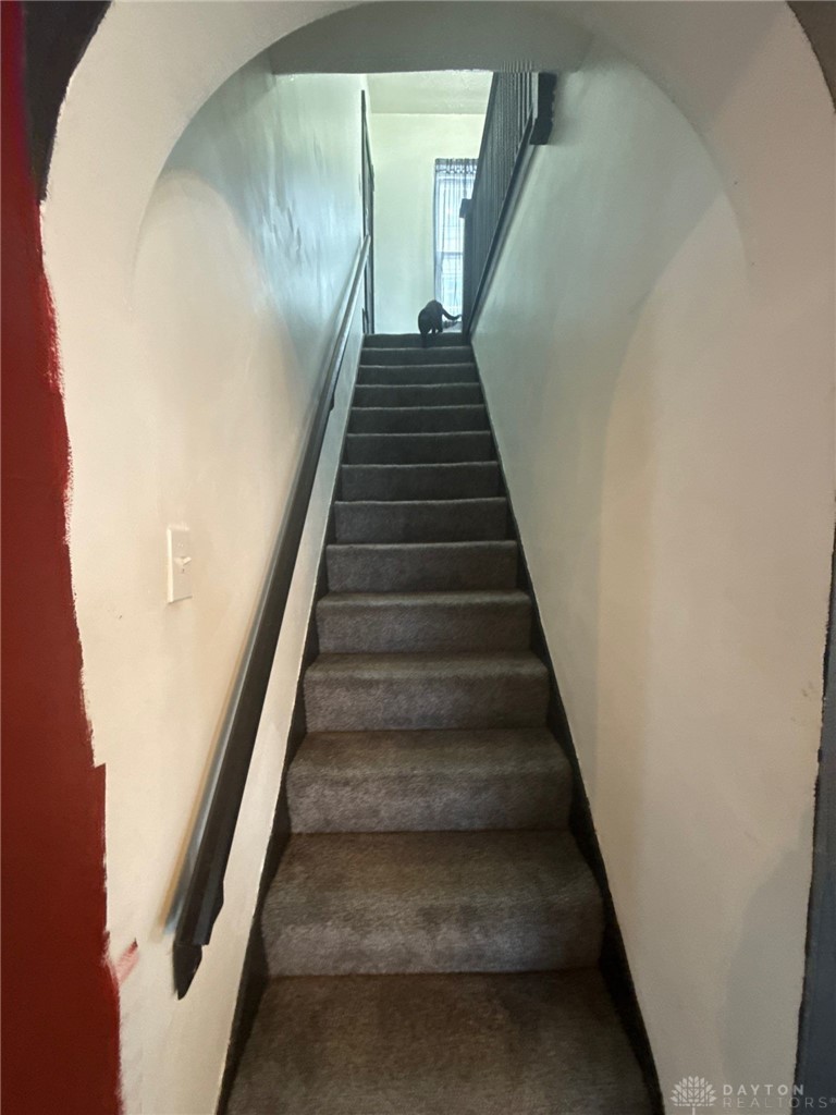 1125 West High Street Springfield, OH 45506 - Photo 18 of 39 This interior staircase offers a functional transition between levels.