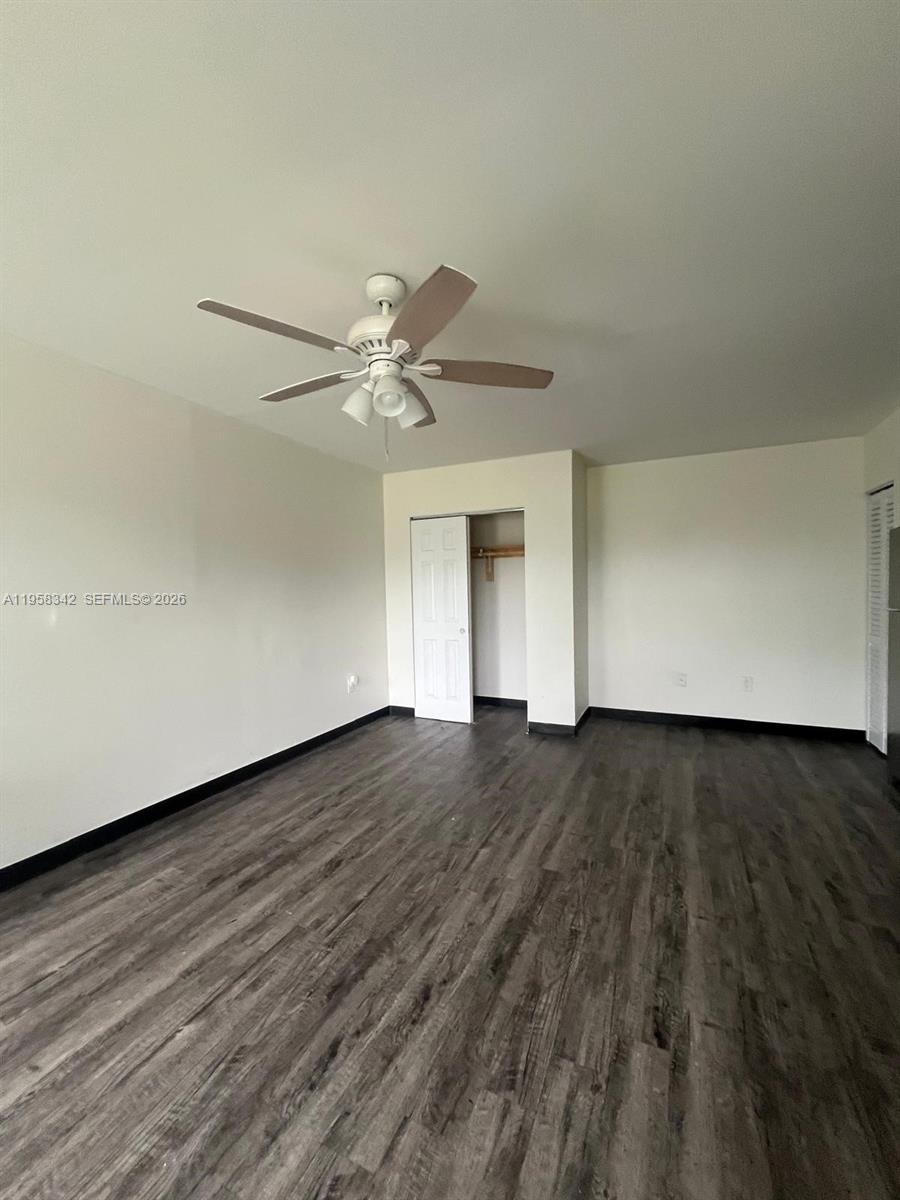 467 Northwest 8th Street, Unit 14 Miami, FL 33136 - Photo 5 of 13 wooden floor in an empty room