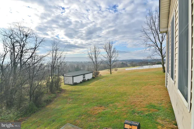 a kitchen with stainless steel appliances granite countertop a refrigerator sink and cabinets