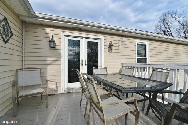 a kitchen with stainless steel appliances granite countertop a refrigerator sink and cabinets