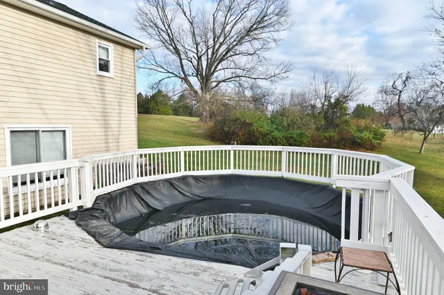 a kitchen with stainless steel appliances white cabinets and a window