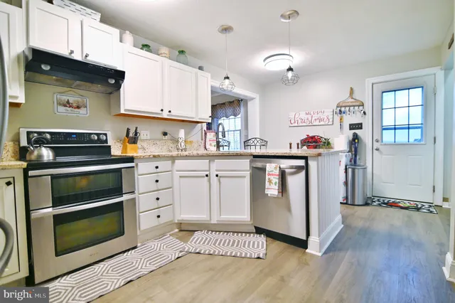 a spacious bathroom with a sink and a mirror