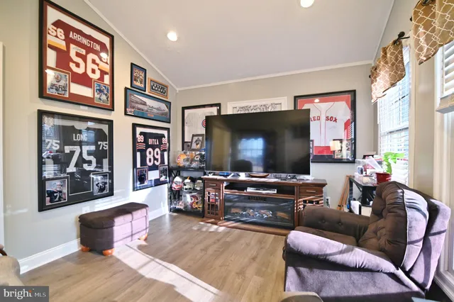 a bedroom with a bed dresser and a window
