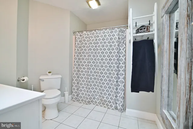 a view of a house with a yard and deck